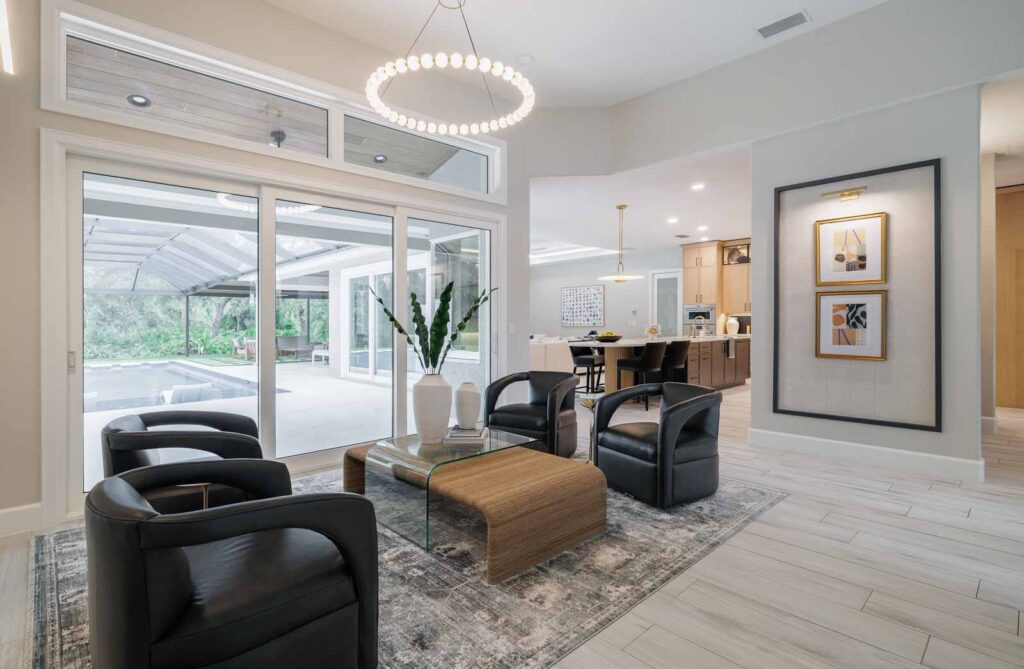Living room with light colored walls and dark seats