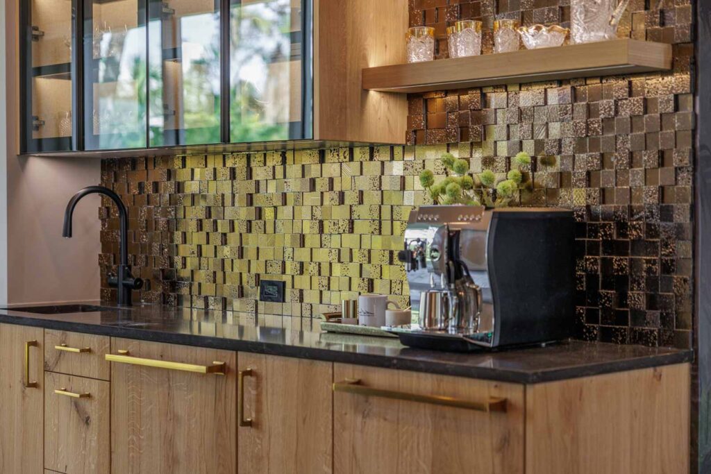 Primary kitchen coffee bar area with dark-colored 3D backsplash tile