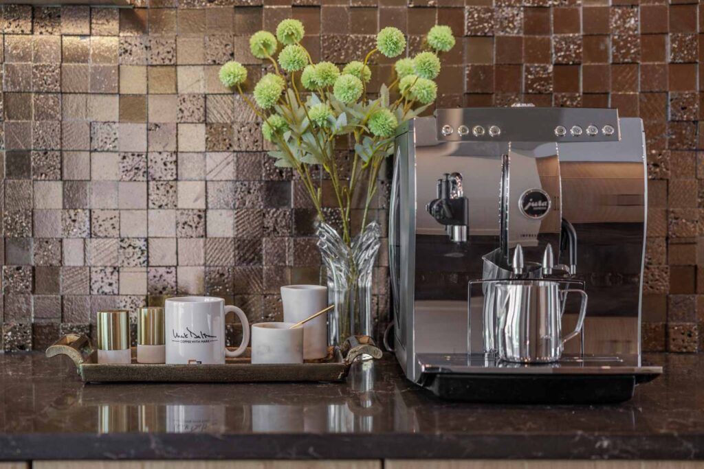 Kitchen detail of beverage center with floral arrangement